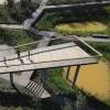 В середине 2009 года китайская компания Turenscape приступила к разработке проекта парка на охраняемой заболоченной территории площадью 34,2 га в новом районе Харбина. Со всех сторон место окружено дорогами и постройками. Доступ воды был ограничен, и местн ...